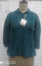 Hand-Knitted Teal Cable Knit Sweater on a mannequin.