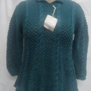 Hand-Knitted Teal Cable Knit Sweater on a mannequin.